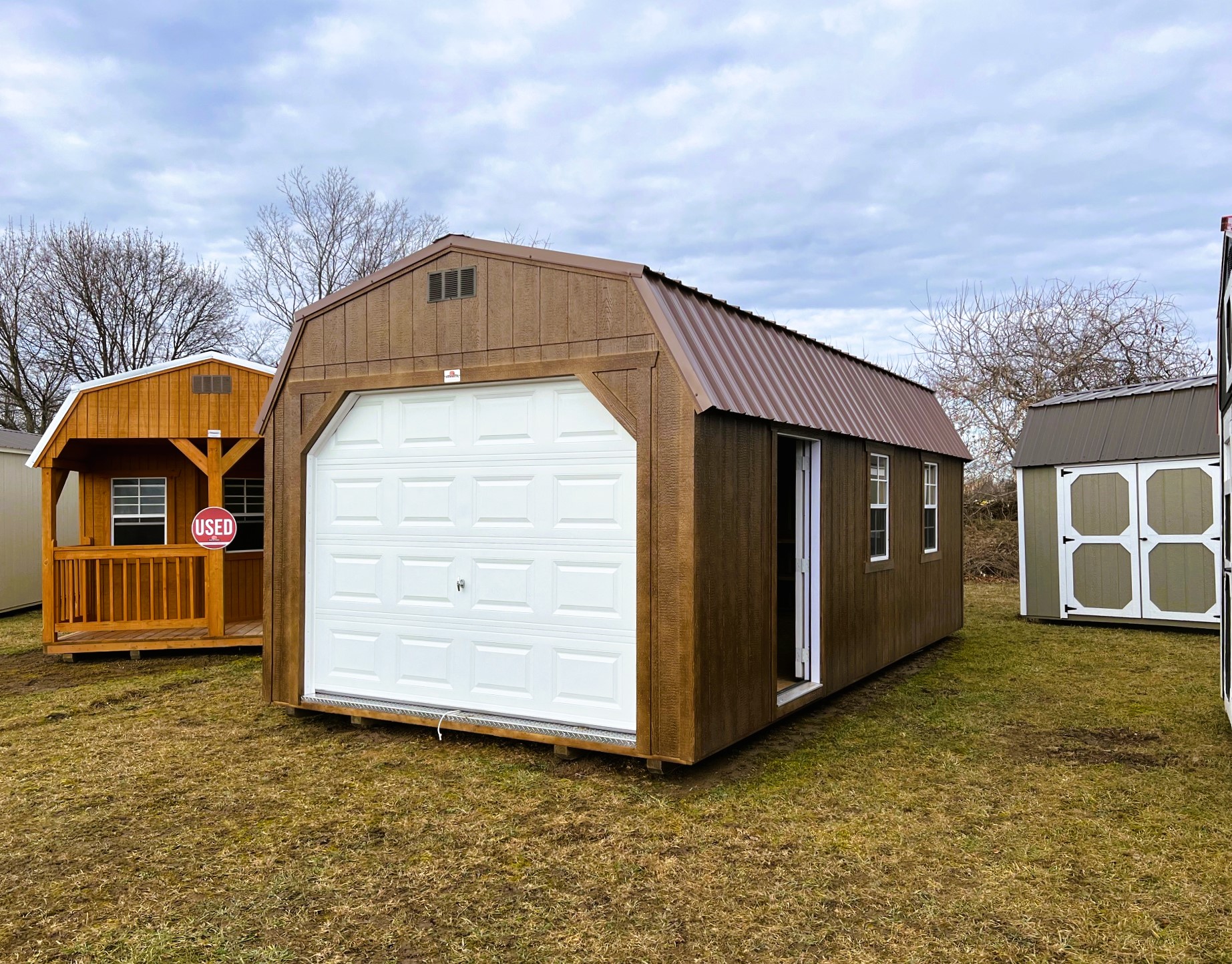 Extra-large garage-style shed showing shed sizes for storing vehicles and large equipment.