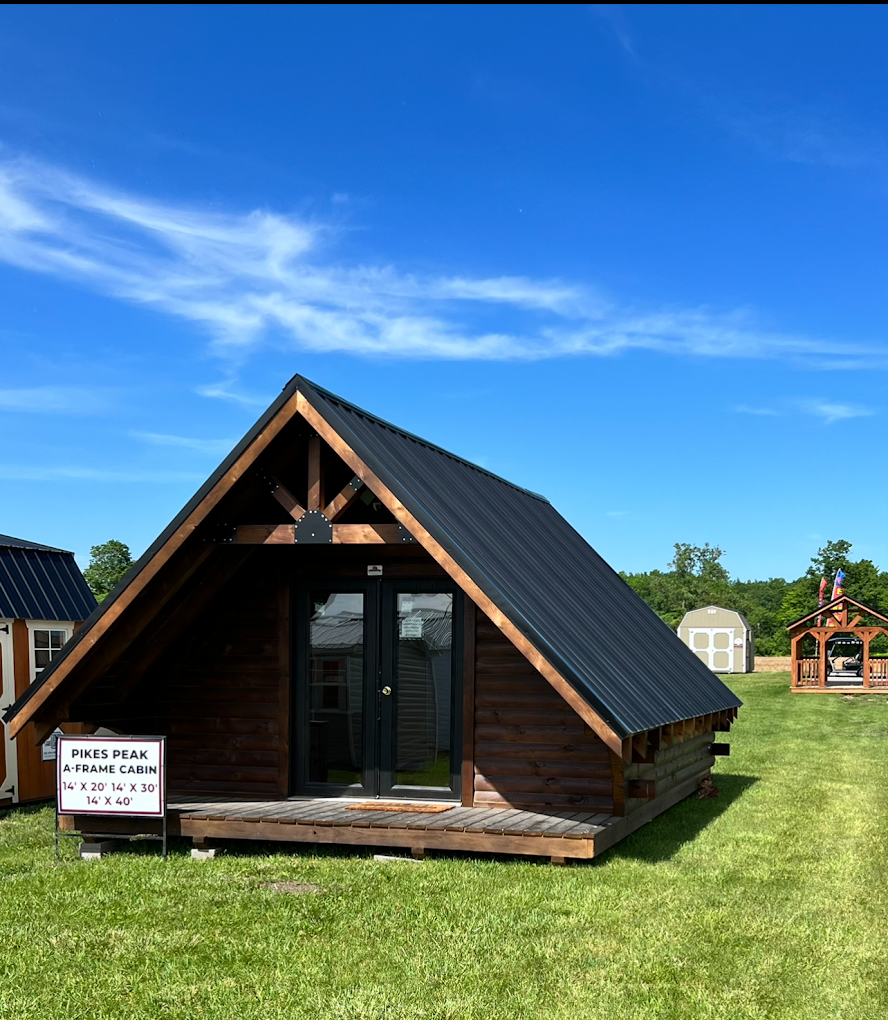 Pikes Peak A-frame cabin with black metal roof and double glass doors.